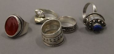Five silver rings.