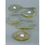 A silver dressing table set.