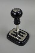 A Ferrari gear stick paperweight. 17 cm high.