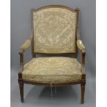 A 19th century French upholstered arm chair. 76 cm wide.