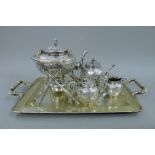 A Chinese silver four-piece tea set, together with an engraved Chinese silver tray. The tray 56.