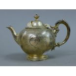 A small Victorian silver teapot. 12 cm high. 263.7 grammes total weight.