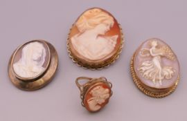 A 9 ct gold cameo ring and three cameo brooches. The largest 5 cm high.
