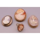 A 9 ct gold cameo ring and three cameo brooches. The largest 5 cm high.