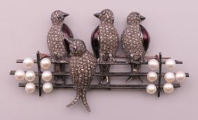 A diamond and pearl set bird form brooch. 9 cm wide.