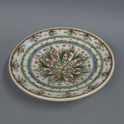 A Persian pottery dish. 35.5 cm diameter.