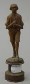 A Blackforest carved figure of a boy. 15 cm high.