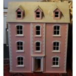 A large doll's house. 86 cm high x 73 cm wide.