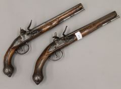 A matched pair of Lazaro Lazarino flintlock pistols. The largest 44 cm long.