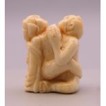 An erotic bone carving. 4 cm high.