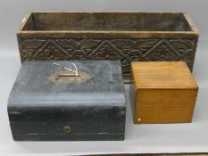 A carved trough, a leather writing slope and an oak box. The former 59 cm long.