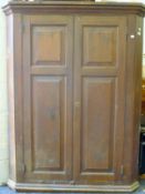 A Victorian pine corner cupboard. 153 cm high.