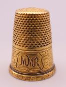 An unmarked gold thimble with engraved initials. 3.6 grammes.