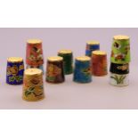 Twelve cloisonne thimbles.