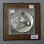 An early 20th century metal portrait of a horse in an oak frame. 20 x 20 cm overall.