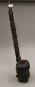 An African wooden pipe. 81 cm long.