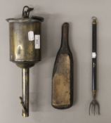 A brass spit jack, a leather makers tool and a toasting fork.