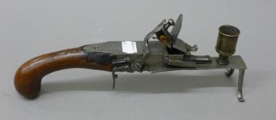 A flintlock tinder pistol. 27 cm long.