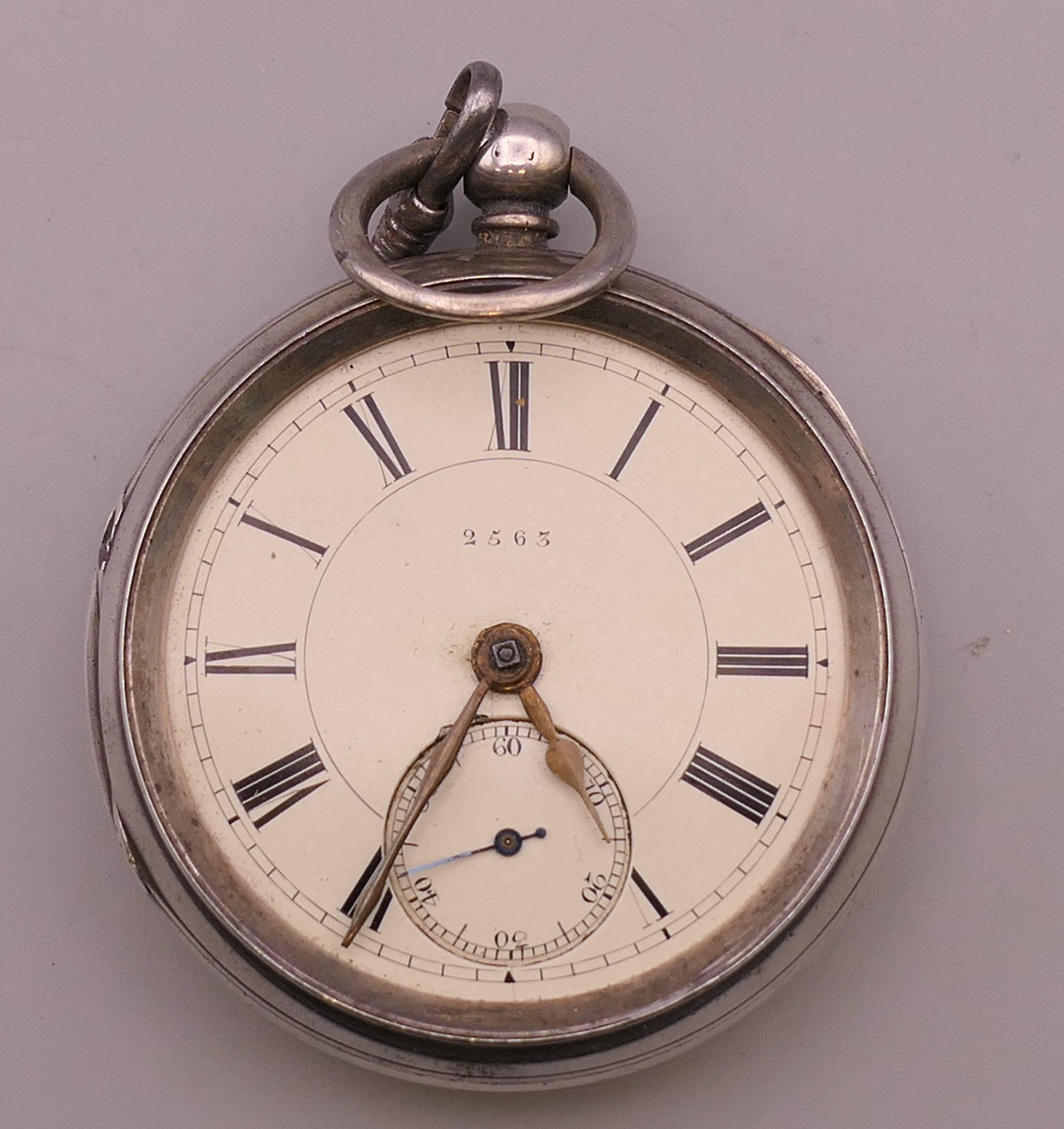 A silver pocket watch.