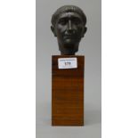 An Italian bronze bust mounted on a wooden plinth base. 25 cm high overall.