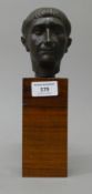 An Italian bronze bust mounted on a wooden plinth base. 25 cm high overall.