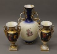 A pair of 19th century Continental porcelain vases and another vase.