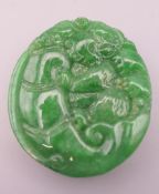 A Chinese carved hardstone pendant, possibly jadeite. 4.5 cm high.