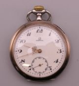 An Omega silver pocket watch. 5 cm diameter.