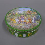 A Huntley and Palmers rude biscuit tin (full and sealed).