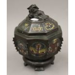 A 19th century Chinese bronze and champleve enamel censer and cover with temple dog finial.