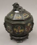 A 19th century Chinese bronze and champleve enamel censer and cover with temple dog finial.