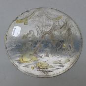 A 19th century etched silvered roundel depicting cherubs. 16.5 cm diameter.