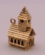 A 9 ct gold charm formed as a church. 4.3 grammes total weight.