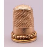 An unmarked gold thimble. 6.5 grammes.