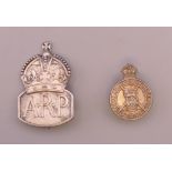 A silver A.R.P badge and a silver Regular Army Reserve badge.