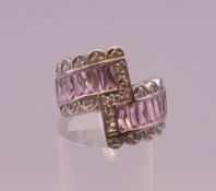 A silver pink and white cubic zirconia ring. Ring size L/M.
