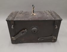 An antique Armada type chest with placement key. 59 cm wide.