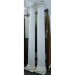 A pair of plaster and fibre glass columns. Each approximately 259 cm high.