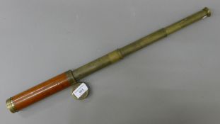 A three-drawer brass and mahogany telescope, inscribed 'G Dixey London'. 58.5 cm long extended.