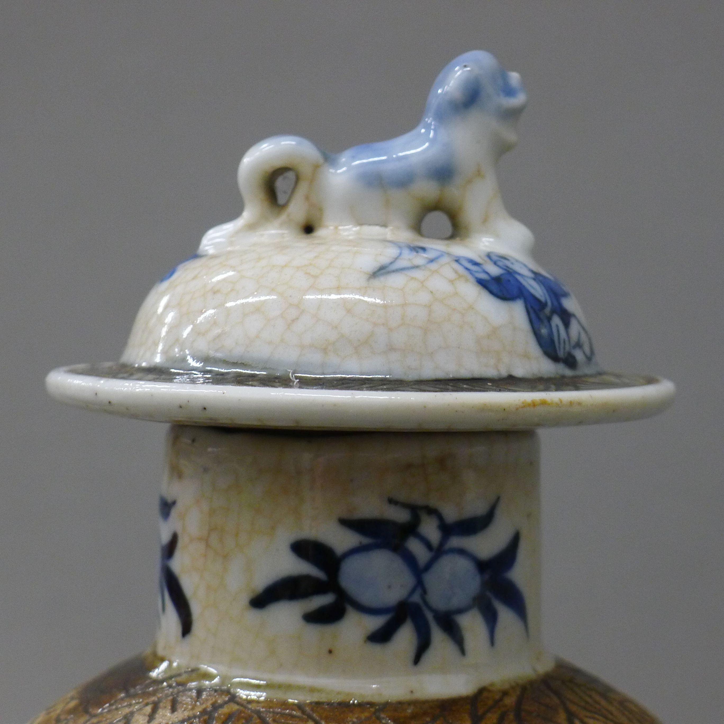 A pair of 19th century Chinese blue and white baluster vases and covers decorated with figures, etc. - Image 4 of 6