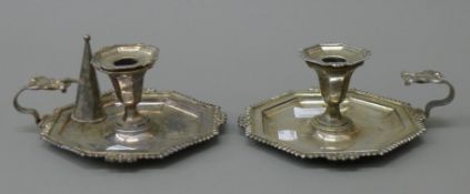 A pair of 19th century silver plated chambersticks. 17.5 cm wide.