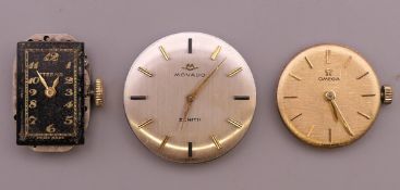 Three watch movements, including Omega.