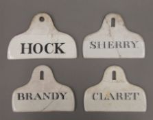 Four 19th century porcelain wine bin labels. The largest 13.5 cm wide.