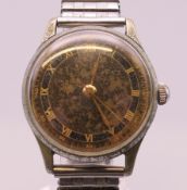 A vintage Lemania gentleman's wristwatch. 3.25 cm wide.