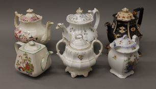 A collection of various porcelain teapots and various cottage ware.