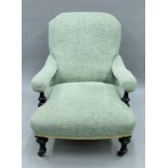 A Victorian upholstered open arm chair. 70 cm wide.