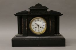 A Victorian marble and black slate mantle clock. 33 cm high.