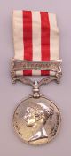 A Victorian 1857-1858 India medal with Lucknow bar, awarded to 9837 Gunner John Murnane Bengal ART.