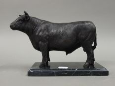 A bronze model of a bull. 27 cm long.
