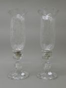 A pair of Baccarat hurricane storm lamps. 39.5 cm high.